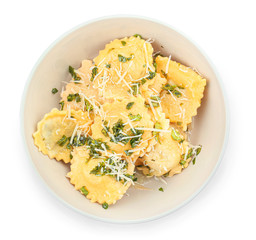 Plate with tasty ravioli on white background