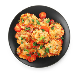 Plate with tasty ravioli on white background