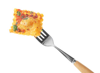 Fork with tasty ravioli on white background