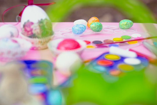 Preparation for Easter. Coloring eggs with watercolors and markers.