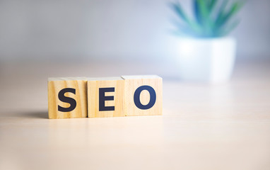 Wooden cubes with the acronym SEO for search engine optimization.