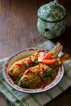Mangut nila is traditional food from indonesia. Made from fried fish mixed with spicy coconut curry sauce