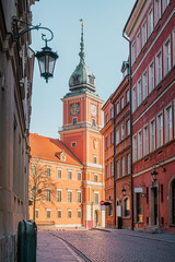 The Royal Castle of Warsaw at the end of a street in the old town of Warsaw
