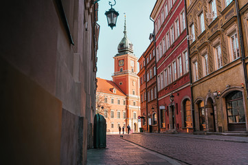 The Royal Castle of Warsaw at the end of a street in the old town of Warsaw