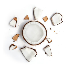 Whole coconut and pieces of coconut on white background - obrazy, fototapety, plakaty