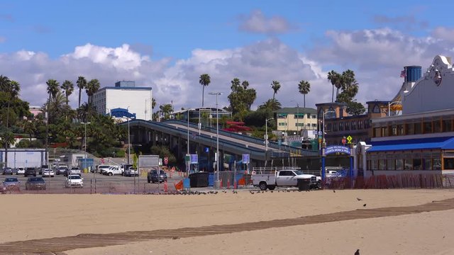 An empty walkway leading to the Santa Monica Pier on a sunny day due to California's COVID-19 (Coronavirus) laws and regulations.