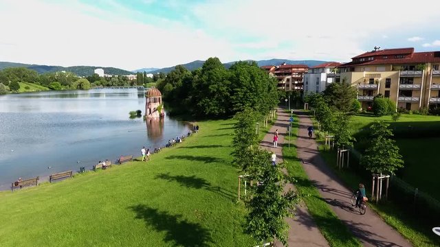 drone flight at a sunny day over the waterside of "Seepark", Freiburg, Germany