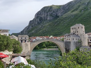 Bridge over river with beautiful town background and hills, Bosnia