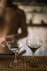 White and green empty cocktail glasses. Smooth image with shallow depth of field.