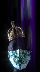 Doll head wearing medical urban luxury gem protective mask and gold crown. Fashion creative design trend during virus disease, COVID 19  coronavirus pandemic and self isolation quarantine.