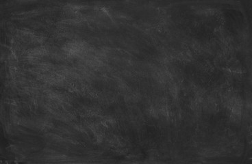 Empty blank black chalkboard with chalk traces