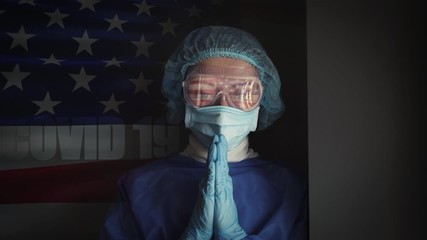 tired medical worker doctor after taking a large number of patients due to the epidemic of coronavirus against the background of the usa flag collage - Powered by Adobe