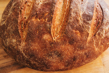 Round rye homemade bread close-up. Fresh, food, bakery, baking, cooking