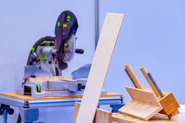 Furniture assembly workshop. Circular saw in a carpentry workshop. Elements for assembling furniture separately. Empty assembly shop. Workplace of a carpenter. Concept - furniture business