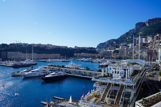 Clean blue sky over the Monaco Bay with many yachts parked over there