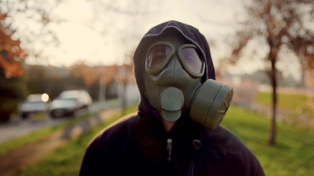 Adult affected by the COVID-19,wearing MC1airborne protection gas mask.Psychological stress of infectious disease panic and fear.Life in polluted contaminated area.Not enjoying spring nature.Allergy 