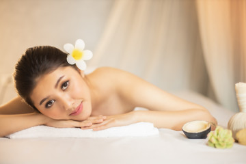 Obraz na płótnie Canvas Asian Beautiful, young and healthy woman in spa salon. Massage treatment spa room . Traditional medicine and healing concept.