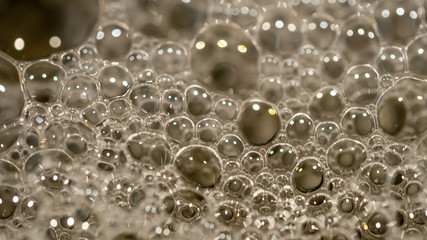 Fototapeta premium A close up of washing detergent bubbles at home in adelaide south australia on 1st February 2020