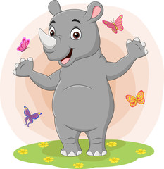 Cartoon happy rhino with butterflies in the grass