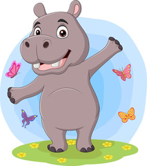 Cartoon happy hippo posing in the grass