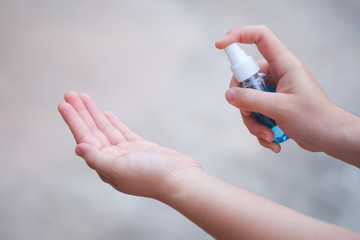 Closeup Women wash hands, blue alcohol gel bottles for cleaning for stop corona virus outbreak.Wuhan coronavirus and epidemic virus symptoms.