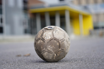 Old Soccer ball in field