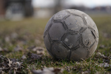 Old Soccer ball in field