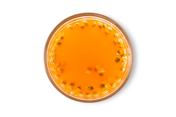 Glass of passion juice ( Maracuya}   isolated on white background . Top view.  