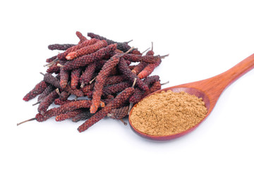 Dry Idian long pepper ( Piper Longum ,Piper retrofractum )with pippali powder in wooden spoon...