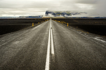 Icelandic road leading to a beautiful mountain