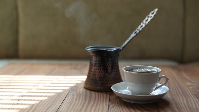 Steaming cup of Turkish coffee. Coffee break.