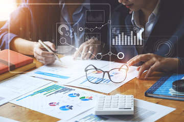 Fund managers team consultation and discuss about analysis Investment stock market by document...