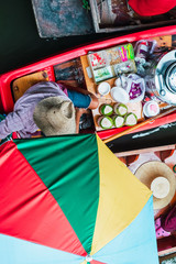 Seller at traditional floating market, Bangkok Thailand. Up view