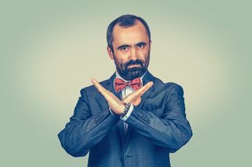 Mature man showing time out of hand gesture