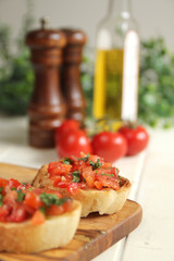 Close up of brushetta with olive oil, garlic and fresh basil