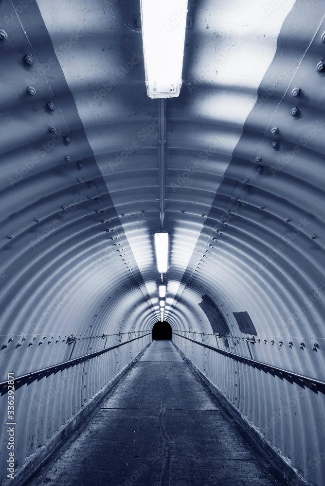Poster empty pedestrian tunnel at night. architecture abstract background
