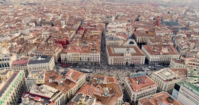 Aerial 4K video of the Puerta del Sol, in the city center of Madrid, Spain.The landmarks of the capital and the centre from bird eye view.Madrid main public square and Sol metro station in Madrid.