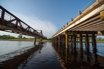 Fototapeta na wymiar Old bridge and new one on channel 1 of Buenos Aires Province