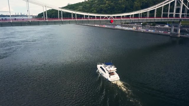 Luxury Motor Yacht Boat Moving Under A Bridge.