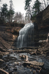 Hidden waterfall in autumn in Hamilton, Ontario with Moody Weather