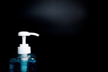 Fototapeta na wymiar hand sanitizer isolated black background with close up shot
