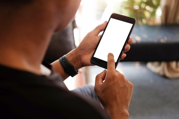 Cropped shot view of man hands holding smart phone with blank copy space screen for your text...