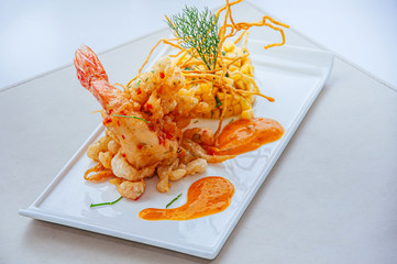 Crispy deep fried tiger prawn with mango salsa and thousand island sauce