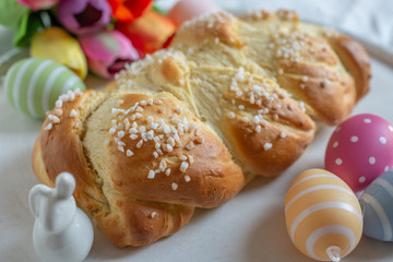 Home made sweet braided bread on a wooden board