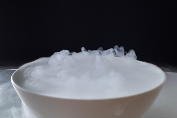 white smoke rising from a bowl.
