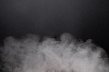 the abstract flow of smoke from a black background.