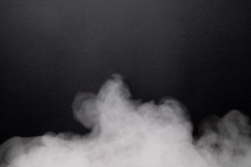 the abstract flow of smoke from a black background.