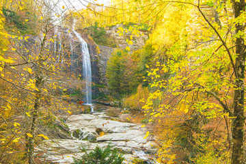 Suuctu waterfall in autumn with golden leafs around and no people. Pristine nature in Turkey. Tourism in  Autumn.