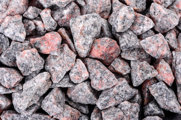 Crushed stone abstract textured background. The rough texture of the stone. Building material background