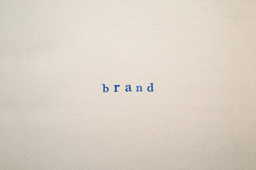 a BRAND word stamped on a piece of paper.